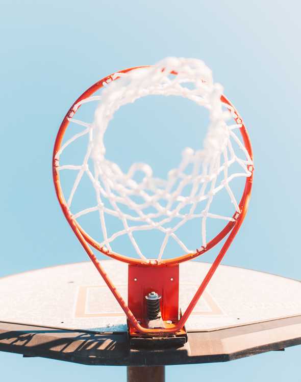 low-angle photography of white and red basketball hoop